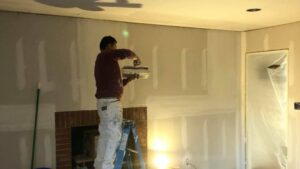 professional performing drywall installation