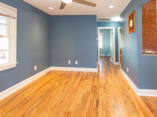 room with blue walls and hardwood flooring